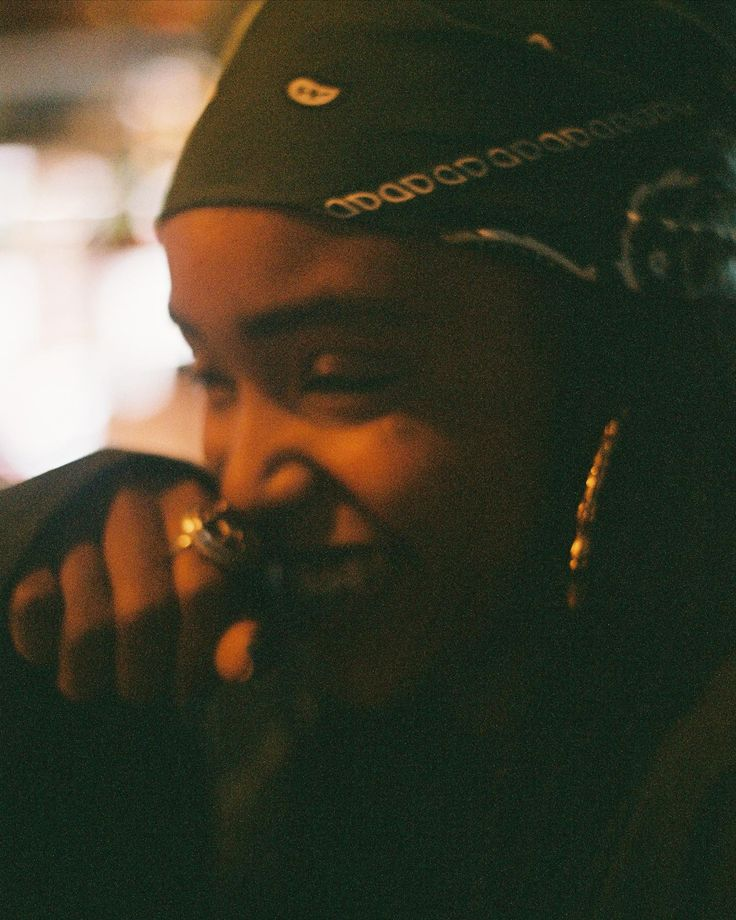 Woman smiling peacefully in a bandana